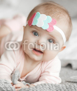 Cute-litttle-baby-at-home-in-the-bedroom.-An-infant-indoors.-6th-month-child-portrait.-Adorable-cute-baby-girl..jpg